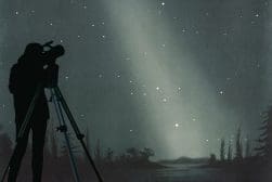 Silhouette of a person using a telescope under a starry night sky with faint light beams and distant trees visible.