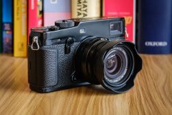 a camera sitting on top of a wooden table.